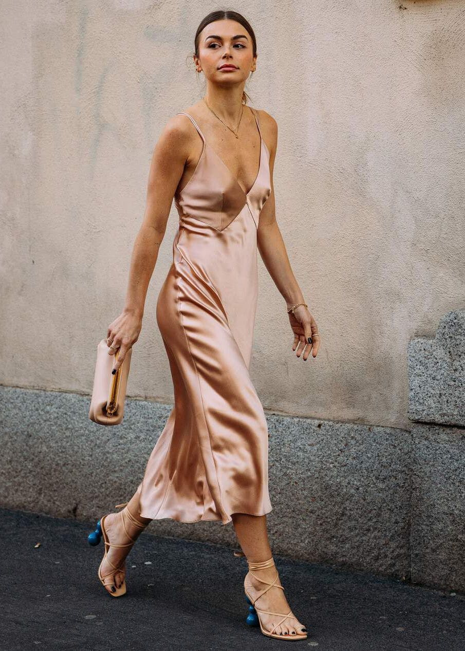 Woman Walking In a Nude Slip Dress